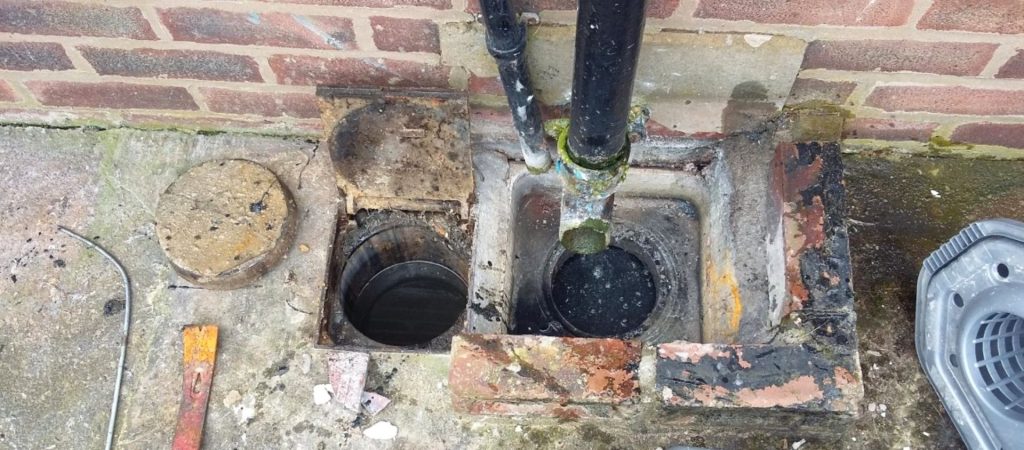 blockage-in-outdoor-drain-from-downpipe-debris